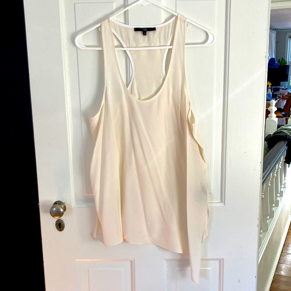 Tibi 100%silk cream racer back tank with assymetrical hem and side slit